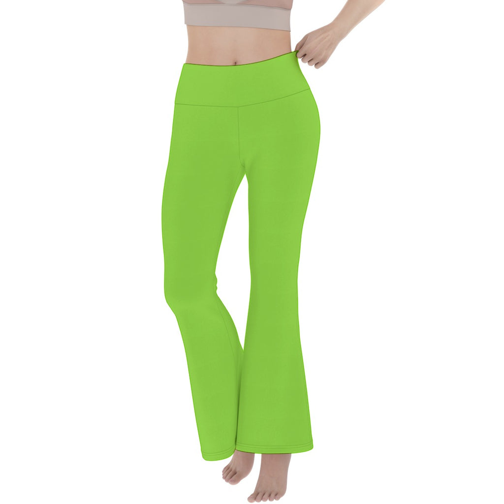Bright green pants worn by a person on a white background